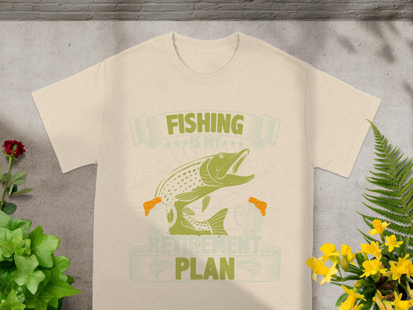 Light tan t-shirt with green graphic: "FISHING IS MY RETIREMENT PLAN".