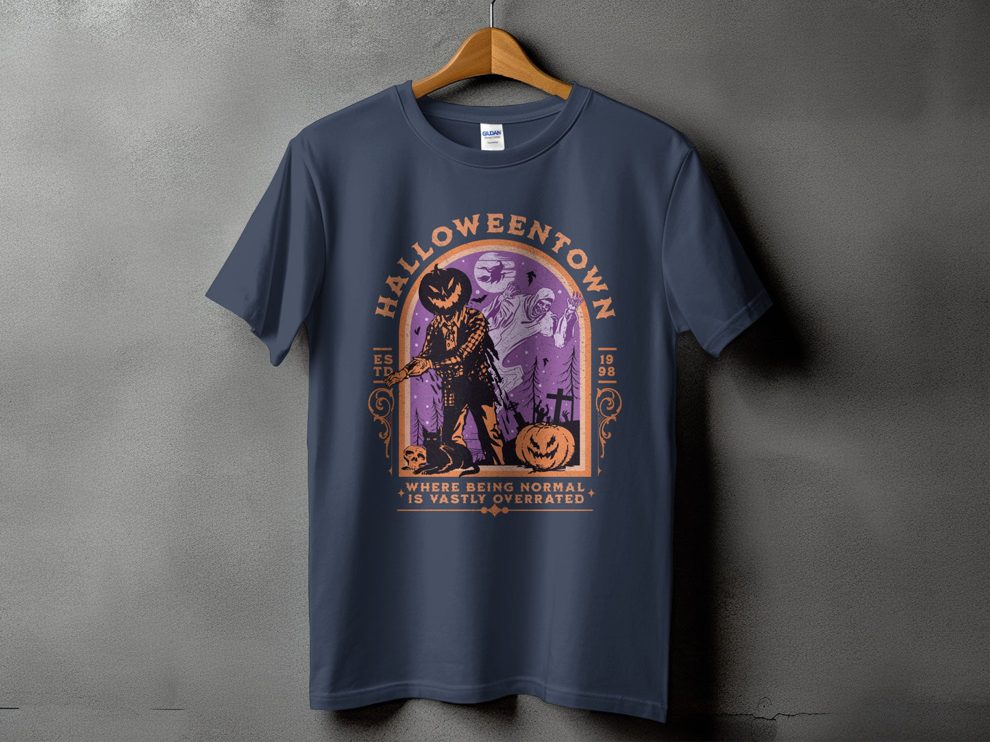 Dark t-shirt with "Halloweentown" graphic featuring a scarecrow, ghost, and pumpkins.