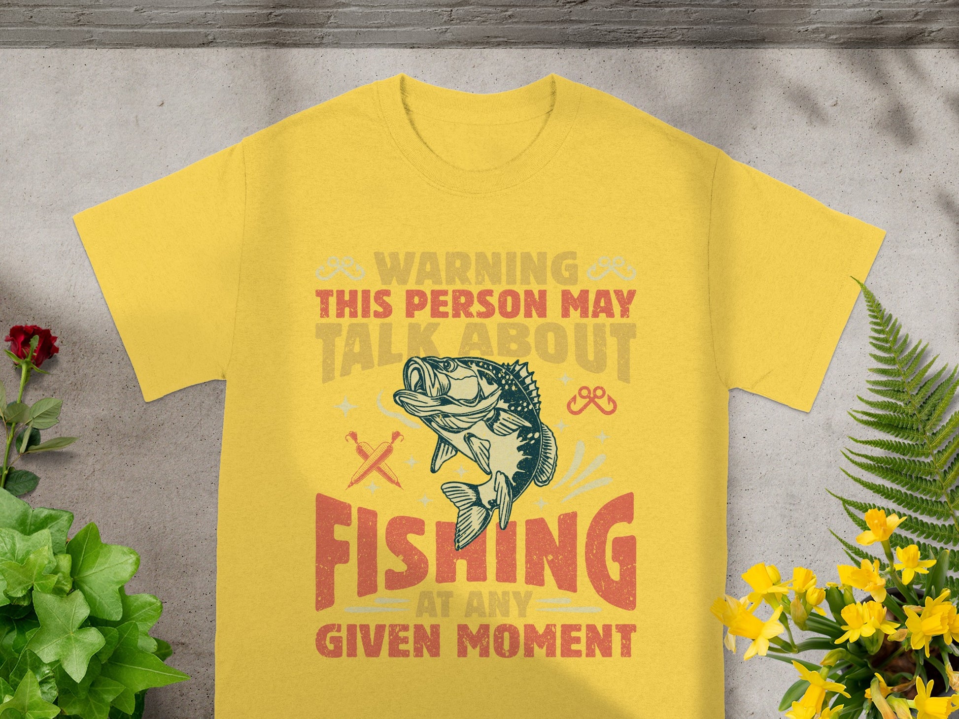 Yellow t-shirt with "Warning this person may talk about fishing at any given moment" text.