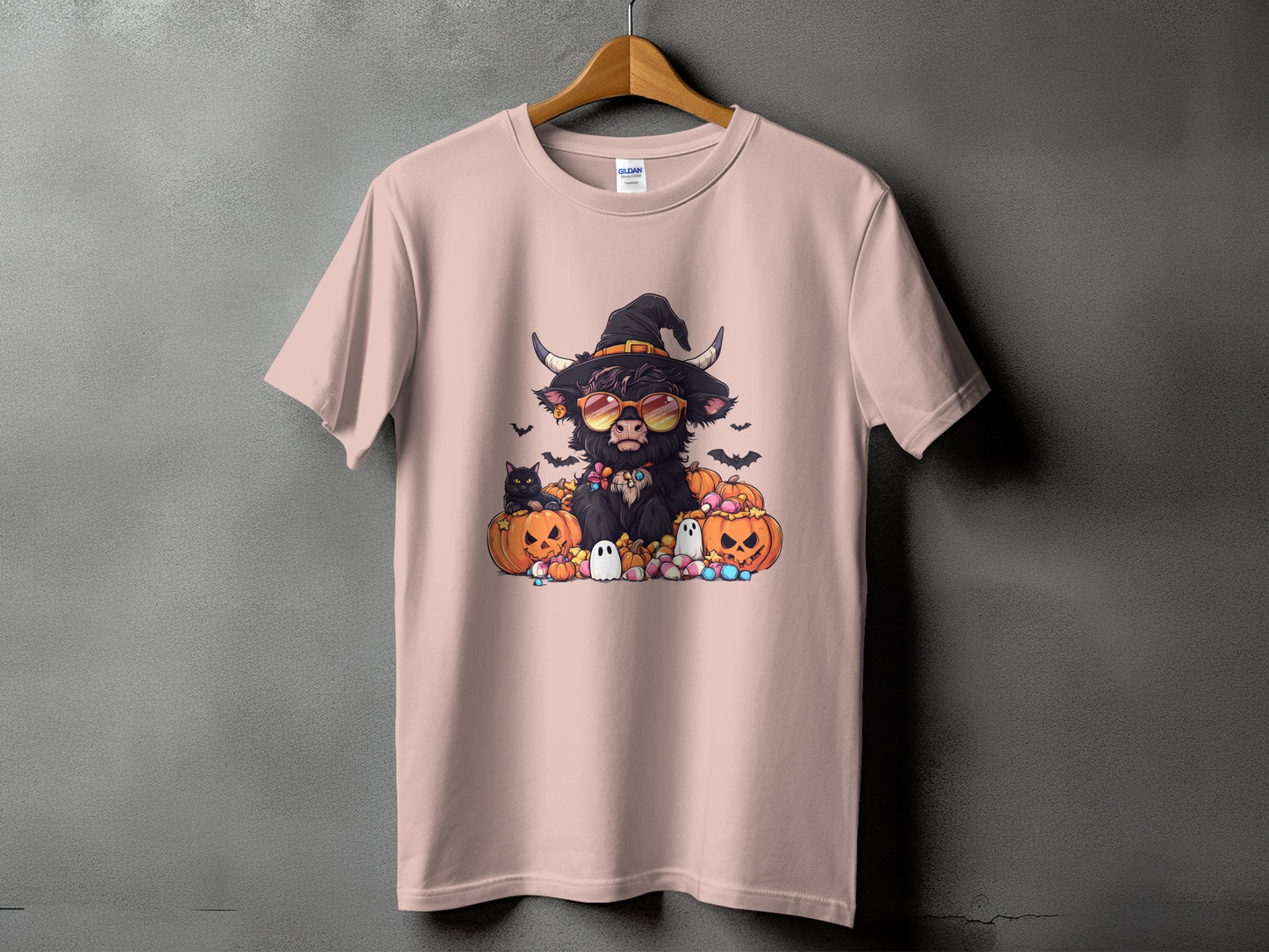 Halloween graphic of a black cow wearing a witch hat and sunglasses, surrounded by pumpkins and ghosts.