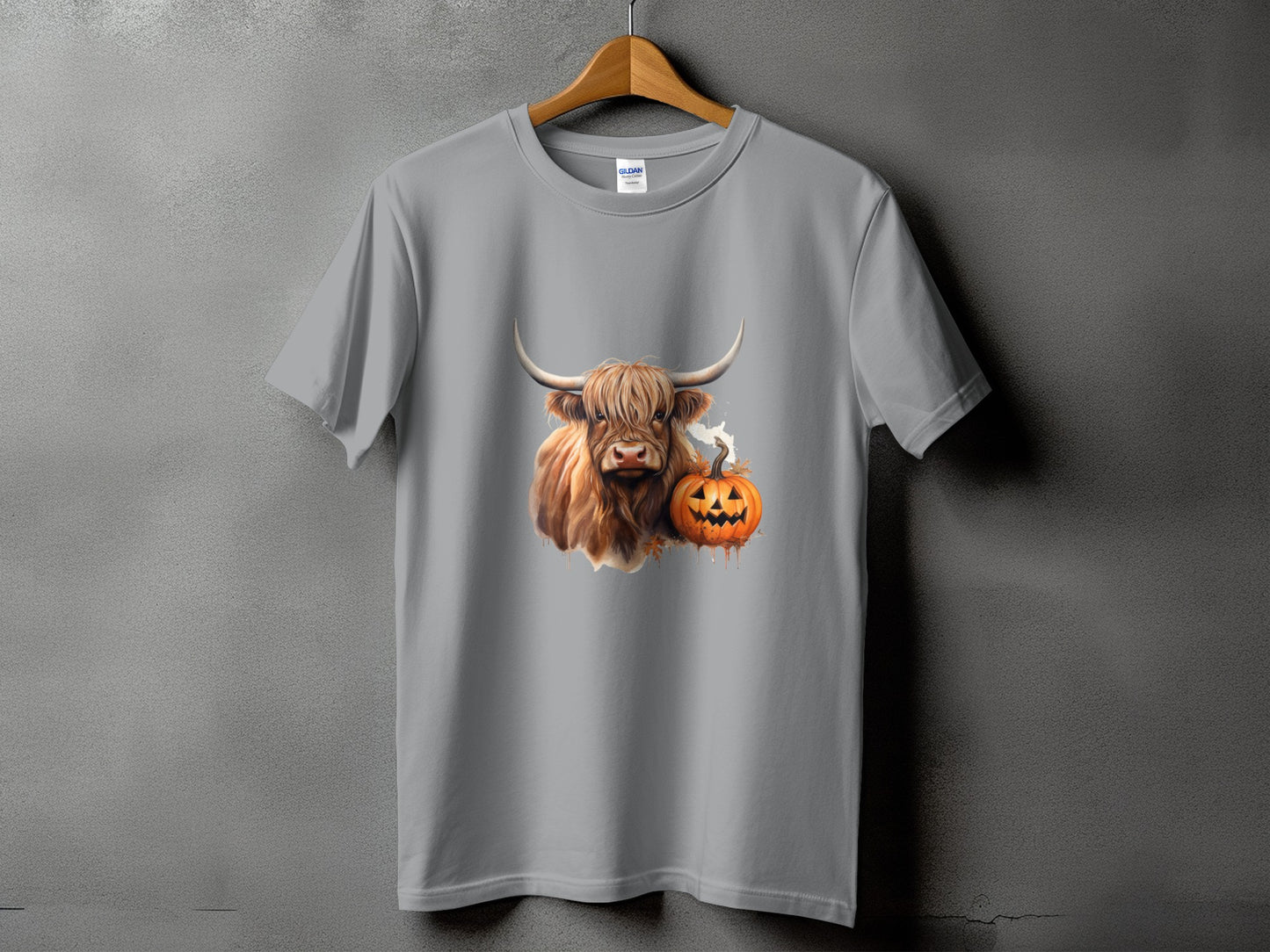 Highland cow and jack-o'-lantern graphic on a gray t-shirt.