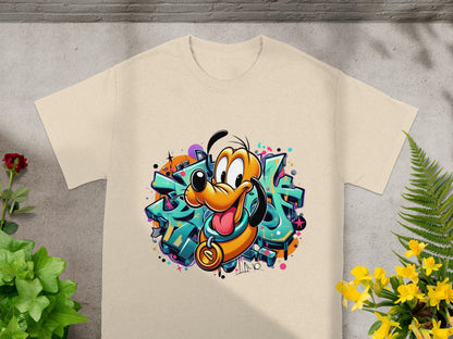 Cartoon Pluto character with graffiti background on a beige t-shirt.