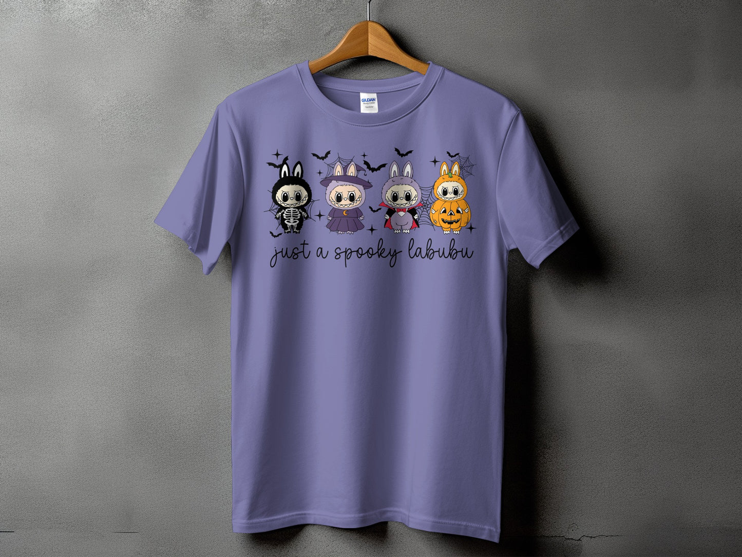 Purple t-shirt with cartoon Halloween characters and "just a spooky labubu" text.