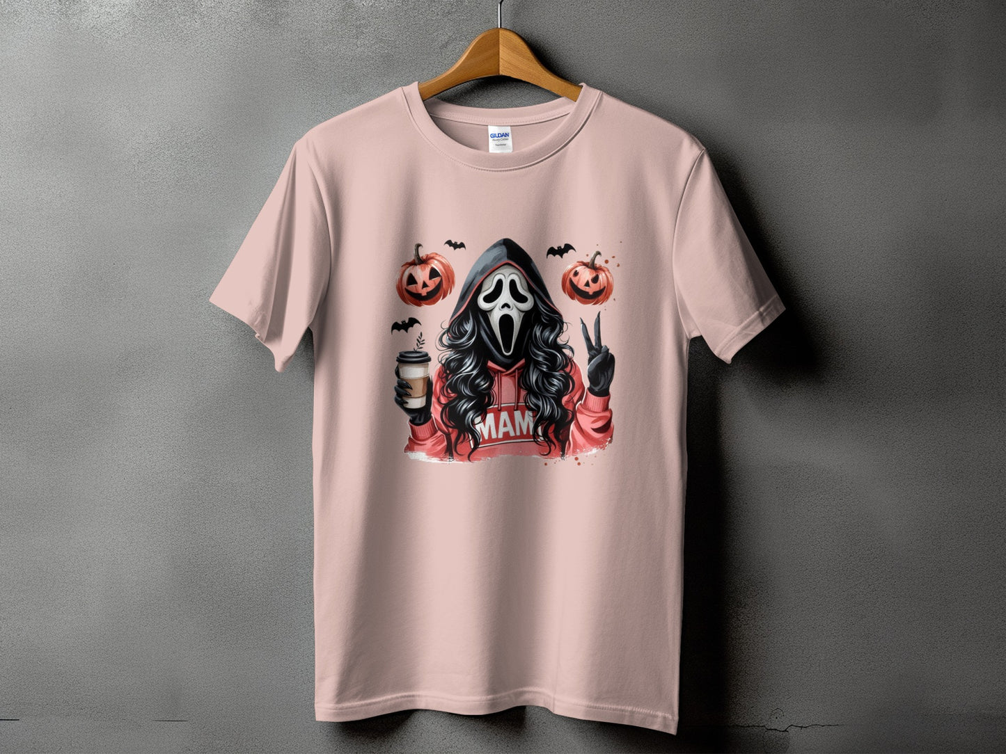 Ghostface graphic on pink t-shirt with pumpkins, coffee, and "MAM" text.