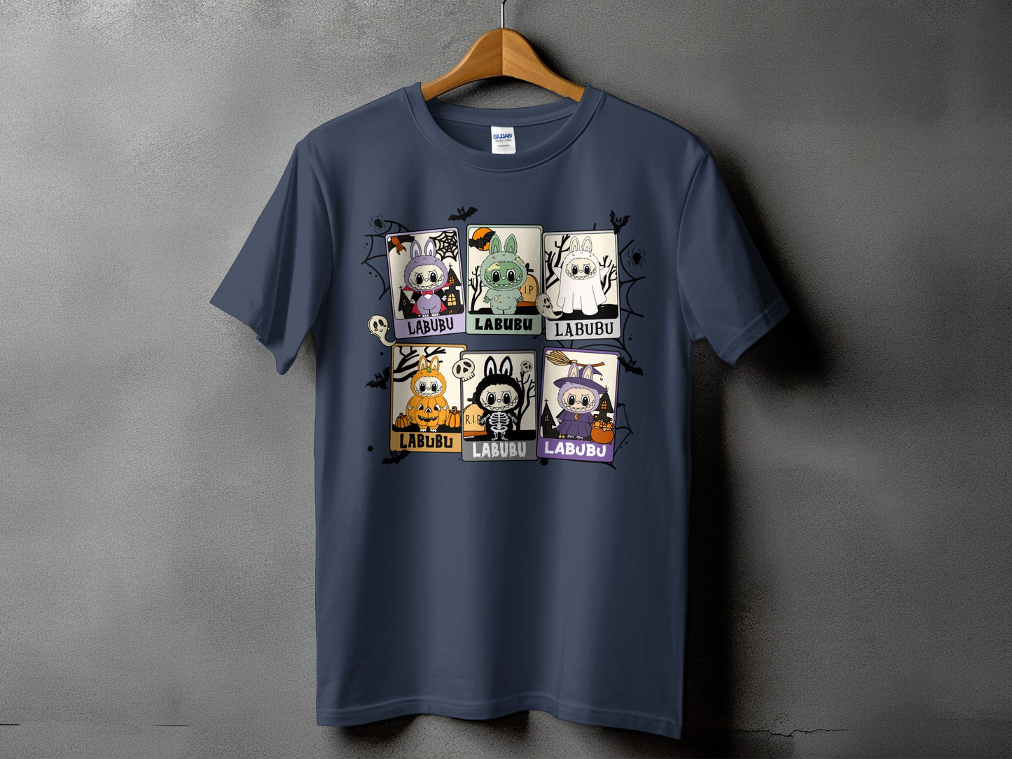 Dark blue t-shirt with six Halloween-themed Labubu character designs.