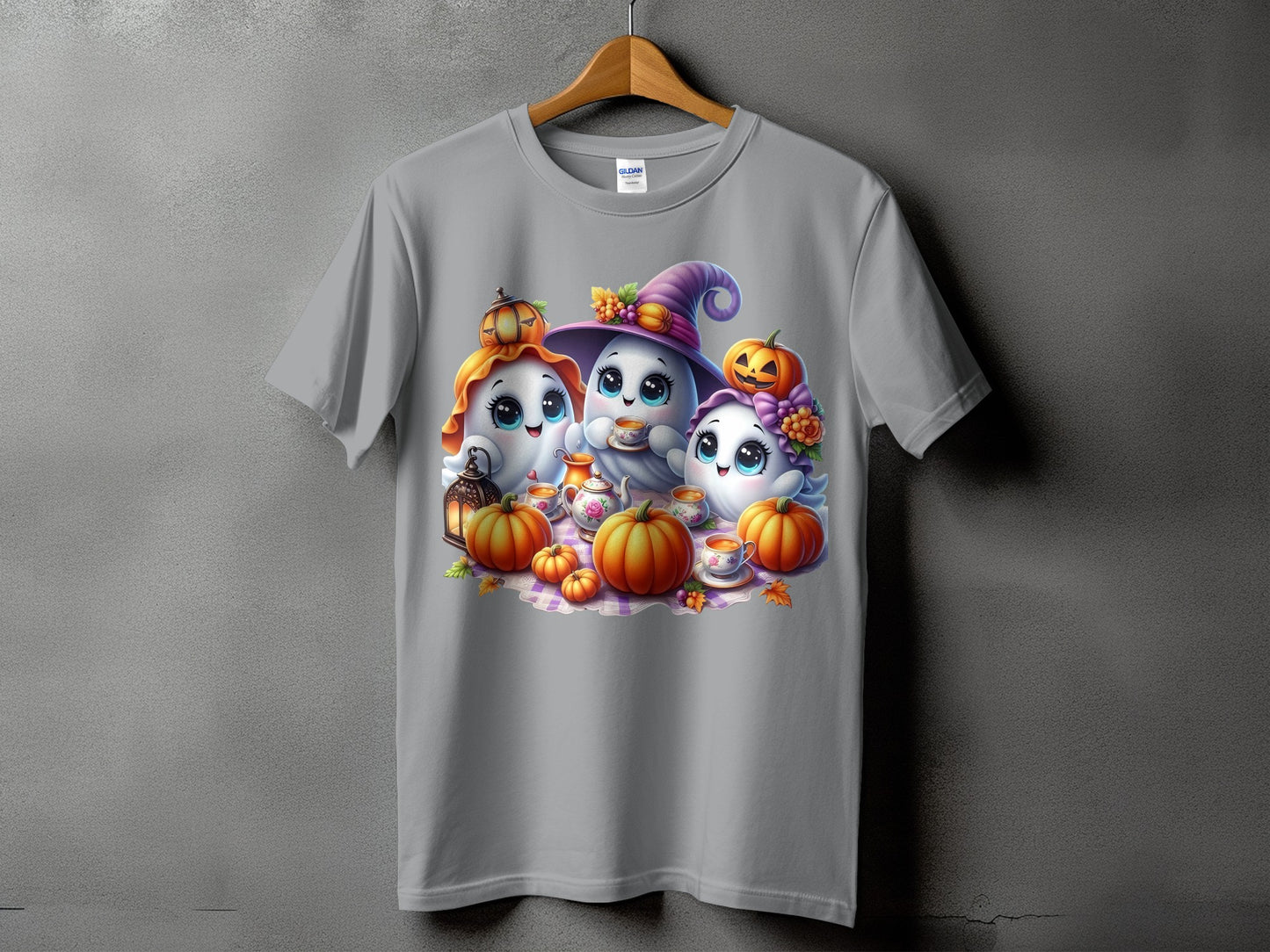 Three cute ghosts with pumpkins, tea set, and lantern on a gray t-shirt.