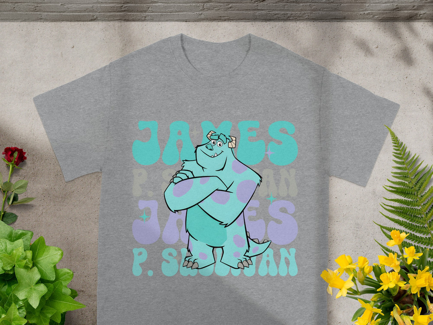 Gray t-shirt with Sully from Monsters, Inc. graphic and "James P. Sullivan" text.