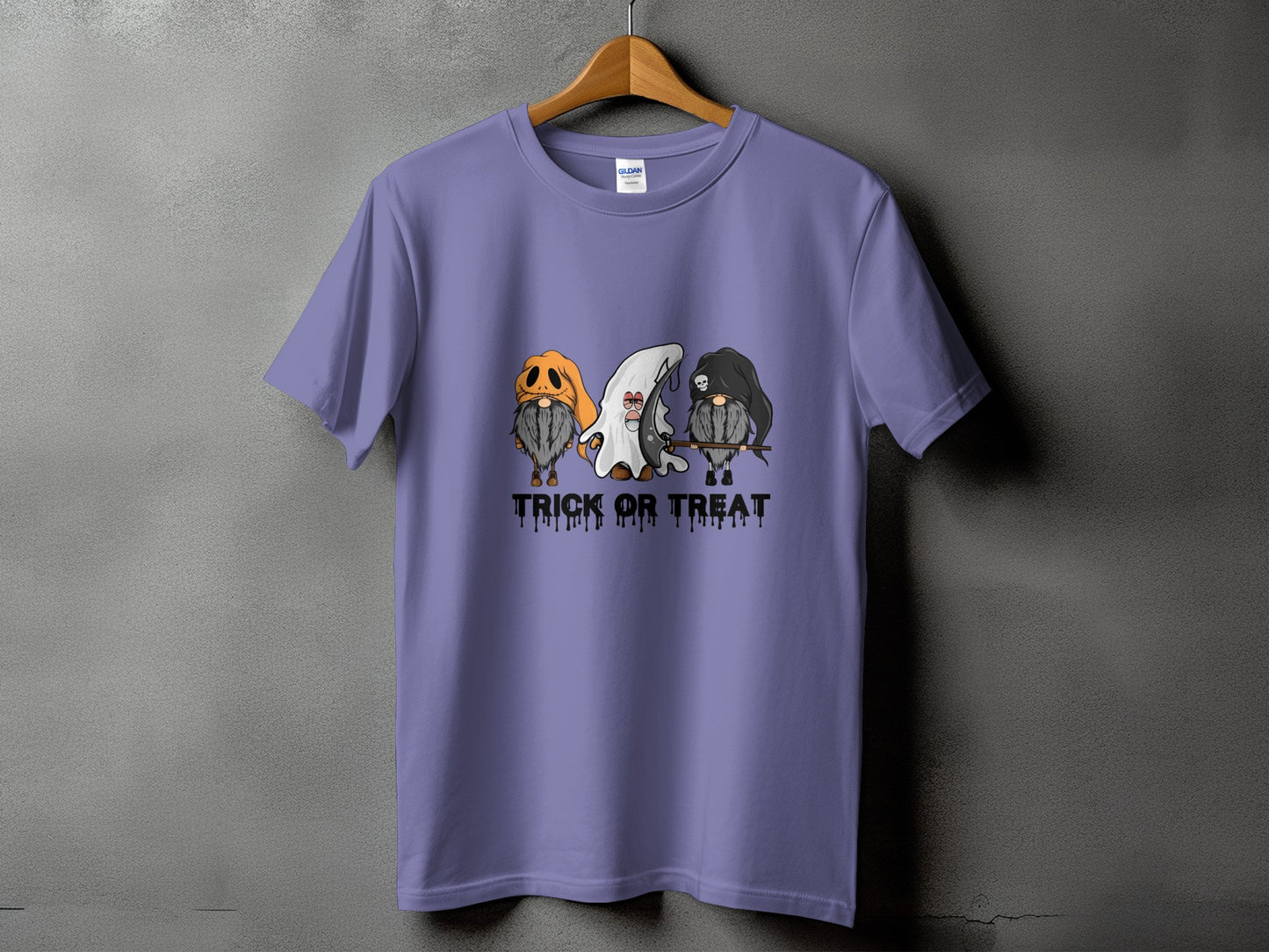 T-shirt with three gnomes in Halloween costumes and "TRICK OR TREAT" text.