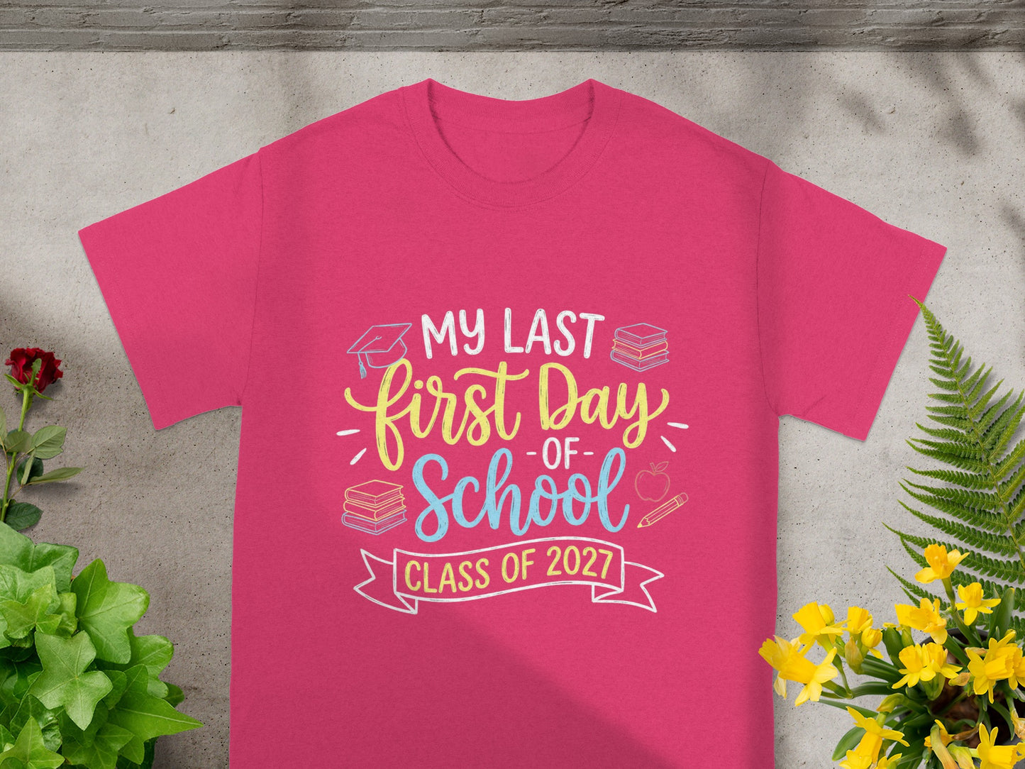 Pink t-shirt with "My Last First Day of School Class of 2027" text.