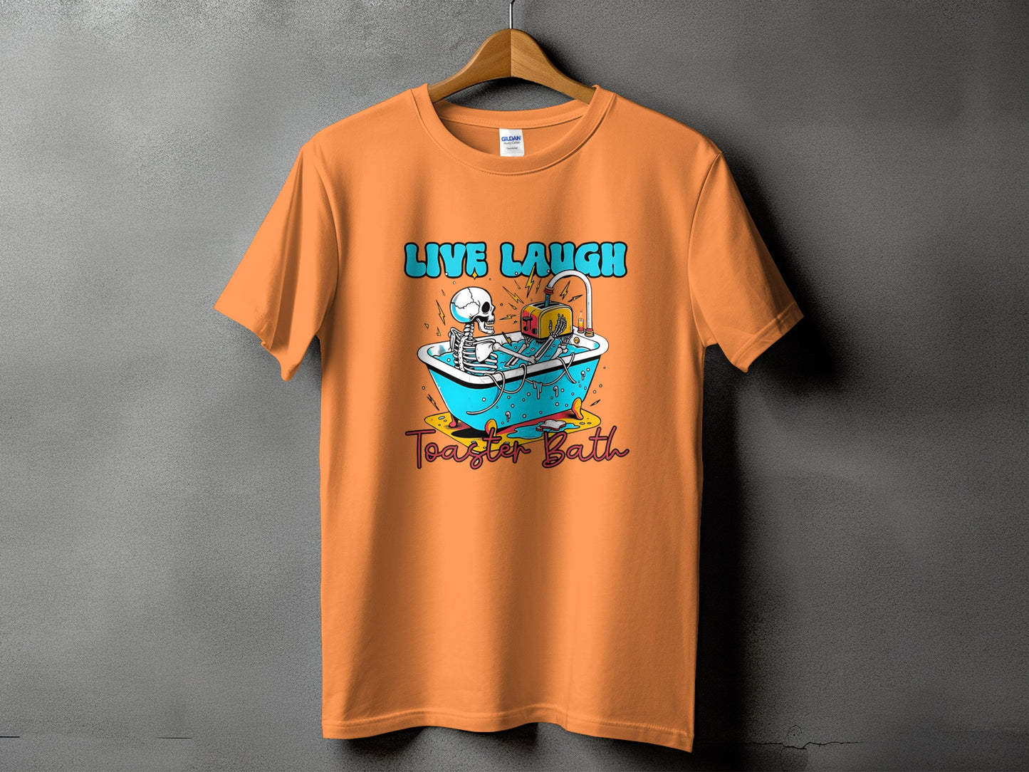 Orange t-shirt with skeleton in bathtub and toaster graphic, text "LIVE LAUGH Toaster Bath".