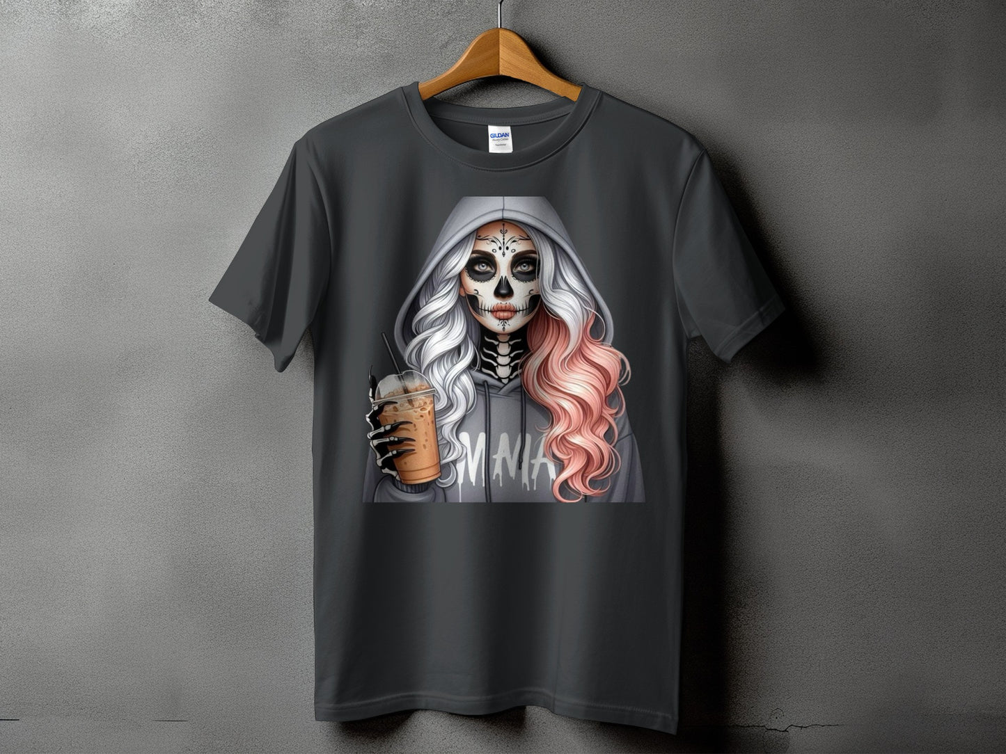 Dark gray t-shirt featuring a skeleton-faced woman in a gray hoodie holding a coffee drink.