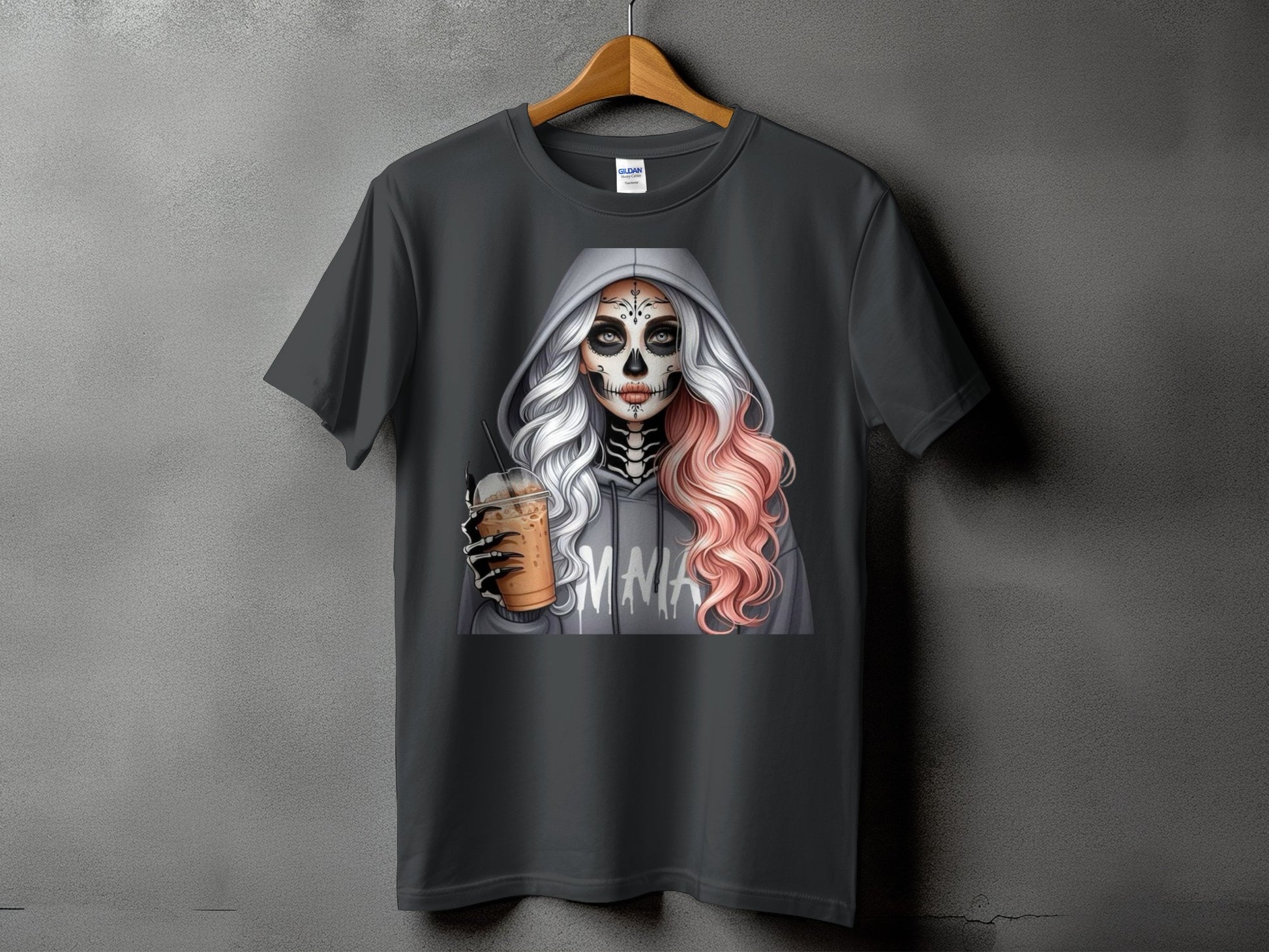 Dark gray t-shirt featuring a skeleton-faced woman in a gray hoodie holding a coffee drink.