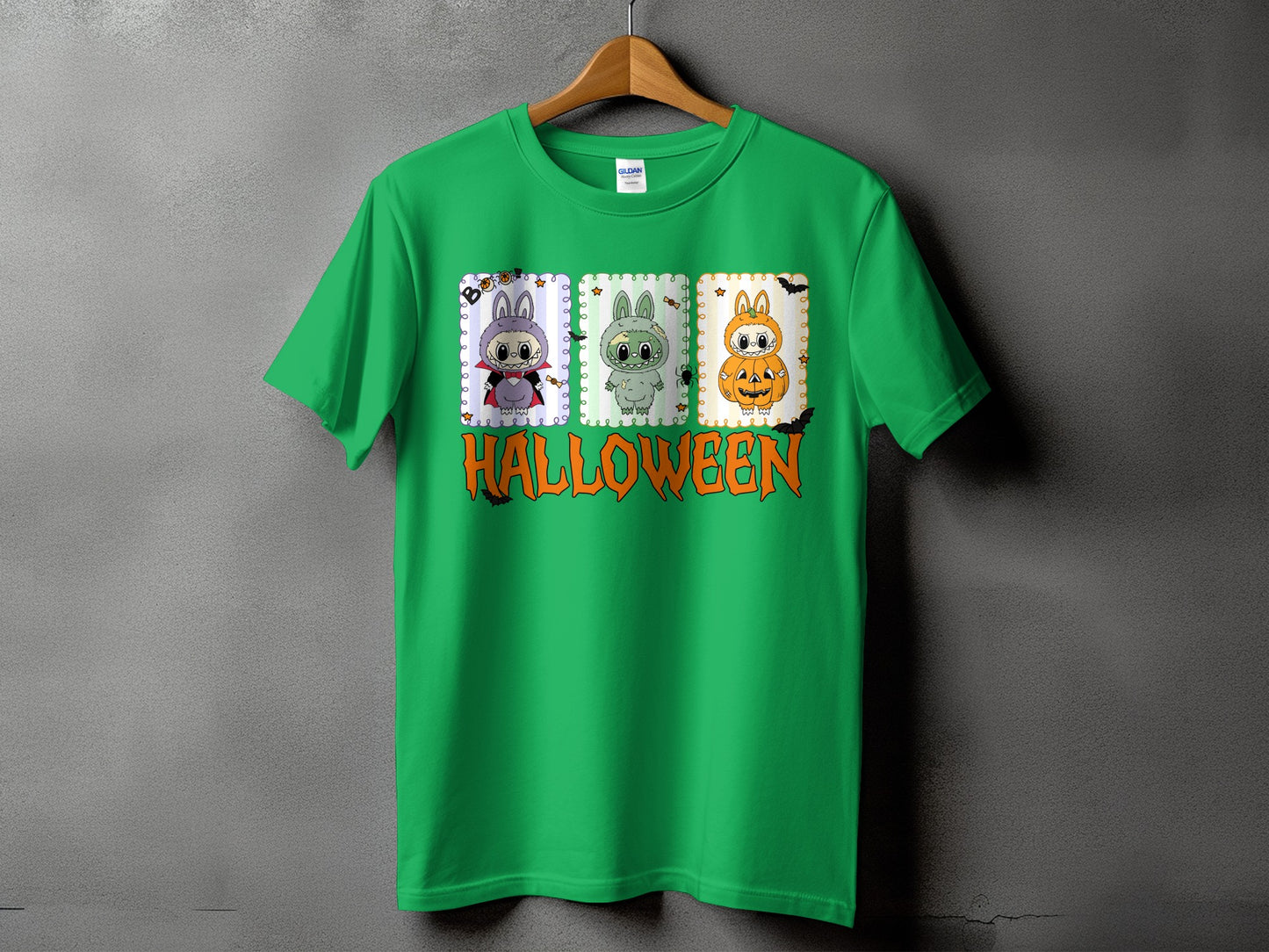 Green t-shirt with three cartoon characters and the word HALLOWEEN.