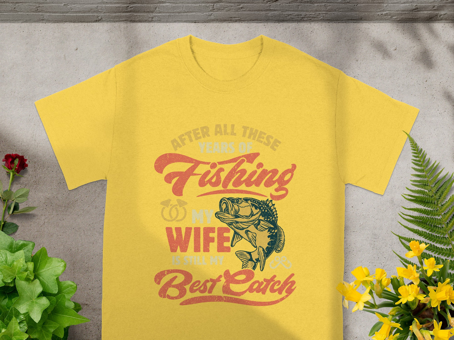 Yellow t-shirt with graphic "After All These Years of Fishing, My Wife is Still My Best Catch."