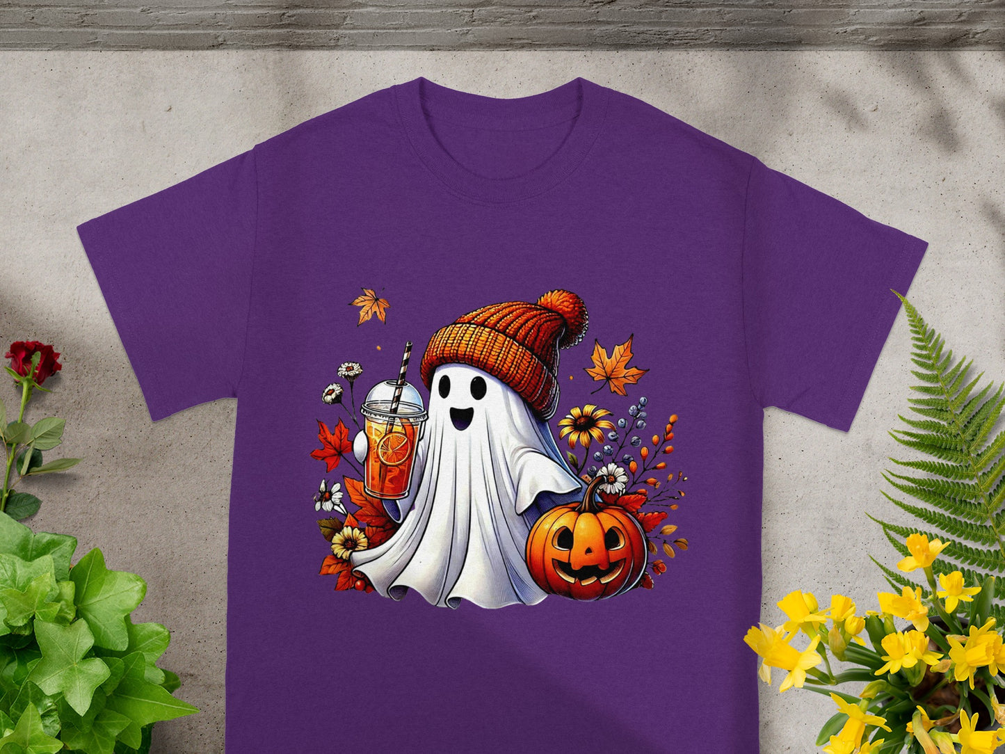 Ghost wearing beanie holds drink next to pumpkin, surrounded by autumn leaves.
