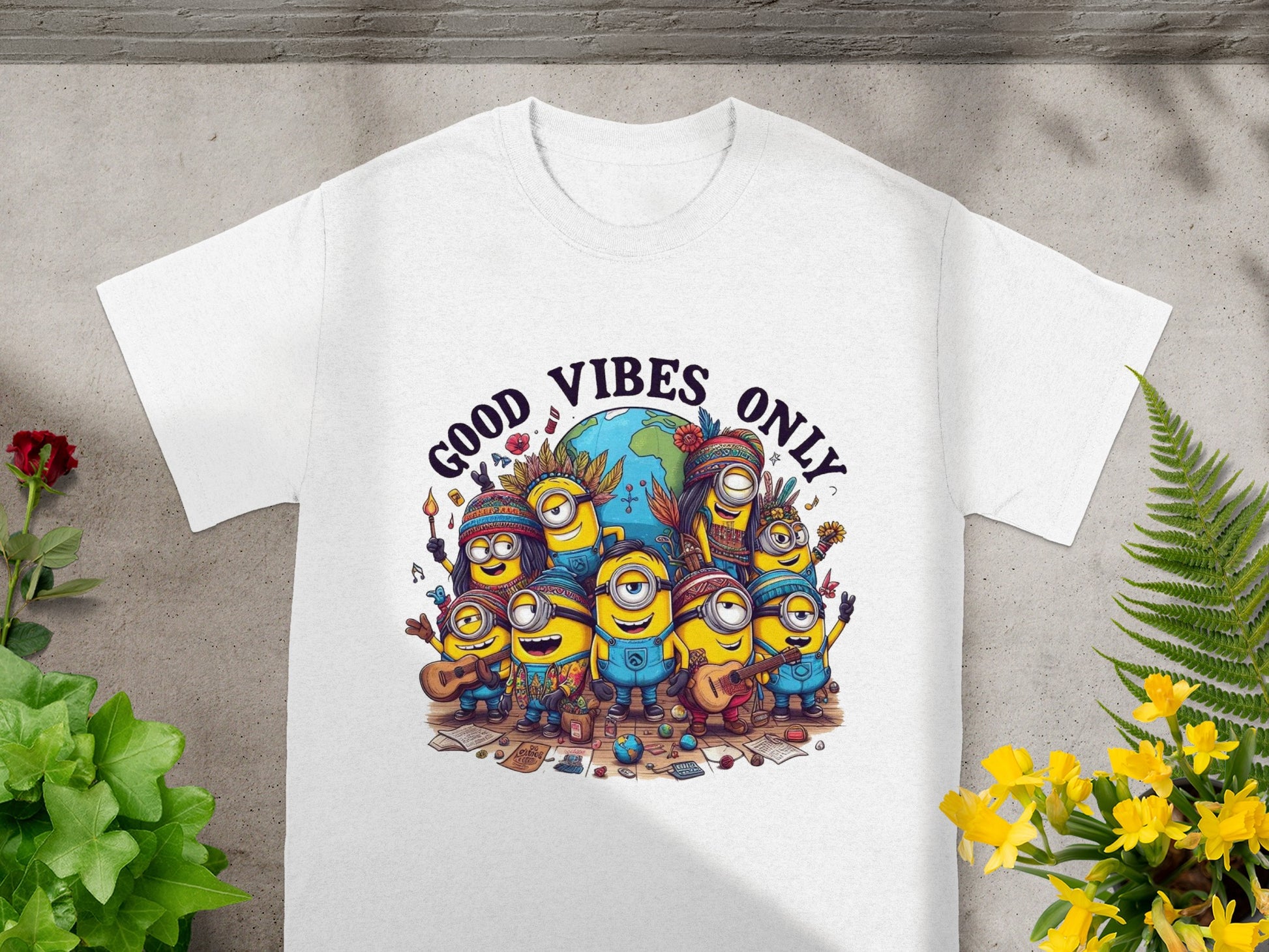 White t-shirt with Minions in hippie attire surrounding Earth, text reads "GOOD VIBES ONLY."
