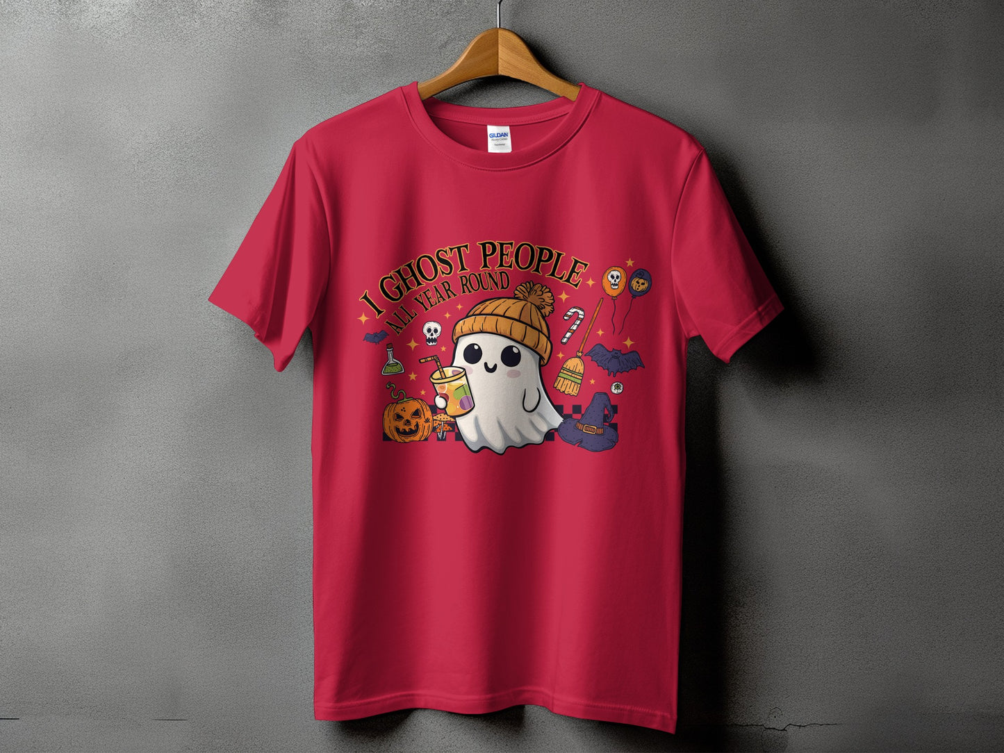 Red t-shirt with a graphic of a ghost holding a drink, with Halloween elements and text.