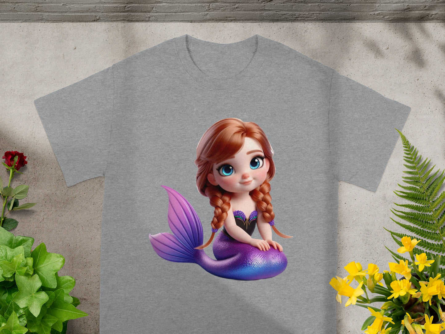 Grey t-shirt featuring a cartoon mermaid with purple tail and braided hair.
