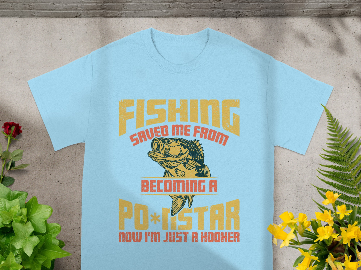 Light blue t-shirt with text and fishing graphic: "FISHING SAVED ME FROM BECOMING A PO*STAR NOW I'M JUST A HOOKER."