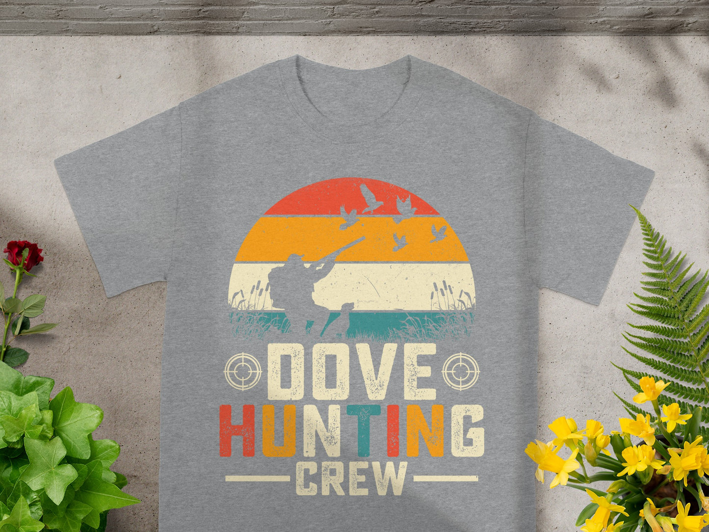 Grey t-shirt graphic with text "Dove Hunting Crew" and silhouette of a hunter.
