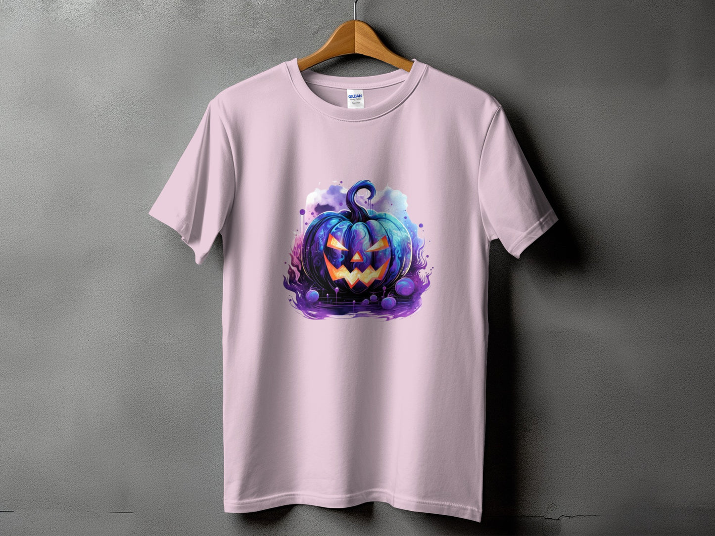 Pink t-shirt with a stylized, glowing blue jack-o'-lantern design.