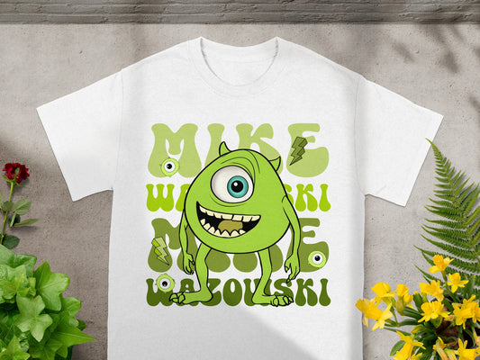 White t-shirt with cartoon Mike Wazowski and green text.
