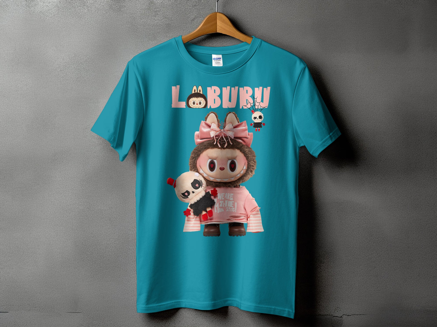 Teal t-shirt with "LABURU" text and a character holding a panda plush.