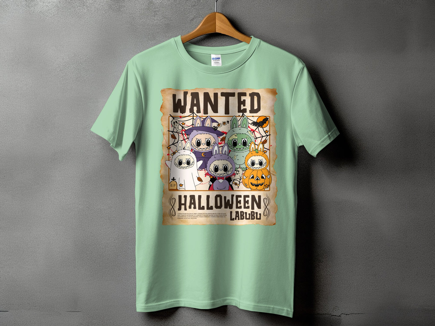Mint t-shirt with a wanted poster graphic featuring cartoon Halloween characters and text.