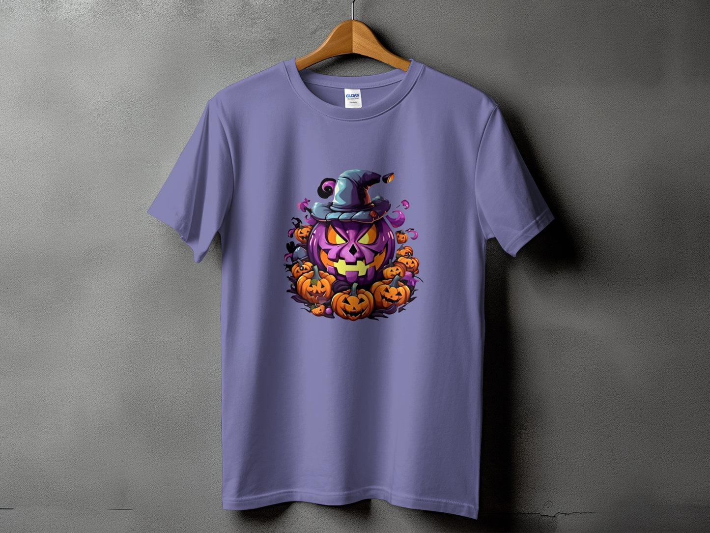 Purple t-shirt featuring a cartoon Halloween pumpkin with a witch hat and smaller pumpkins.