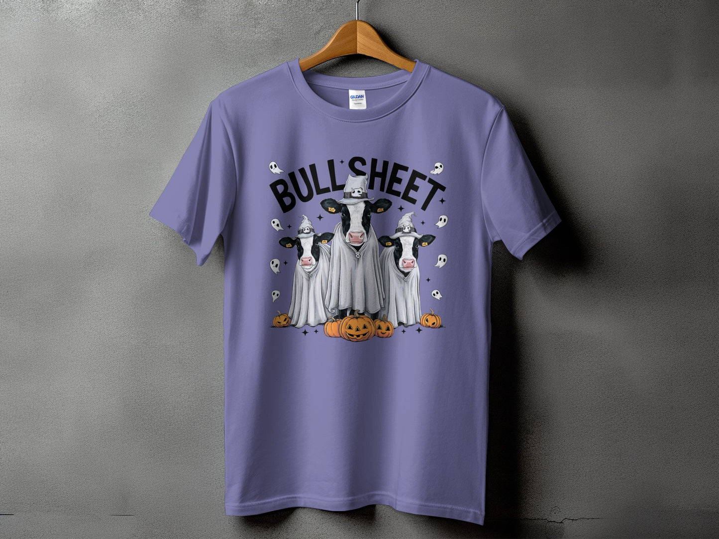 Three cows dressed as ghosts with pumpkins and "BULL SHEET" text.