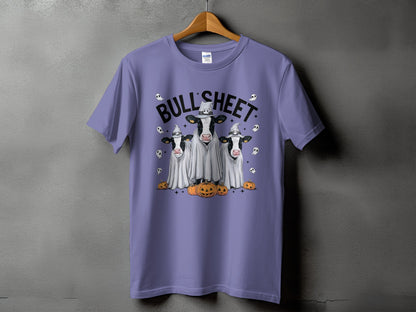 Three cows dressed as ghosts with pumpkins and "BULL SHEET" text.