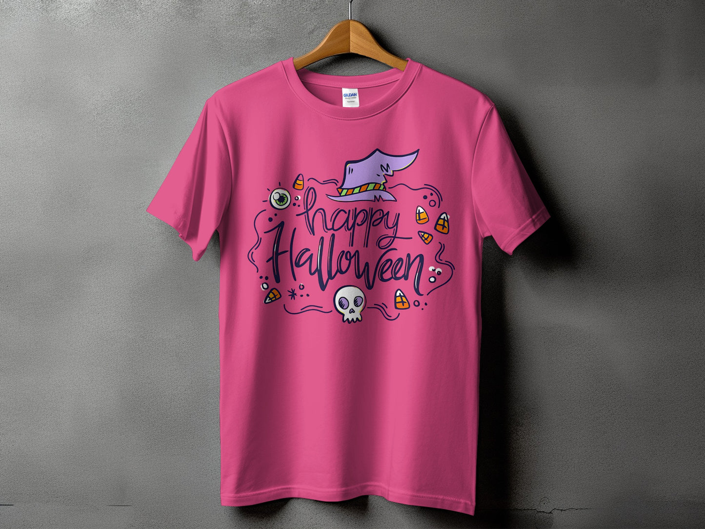 Pink t-shirt with purple "Happy Halloween" text and whimsical Halloween graphics.