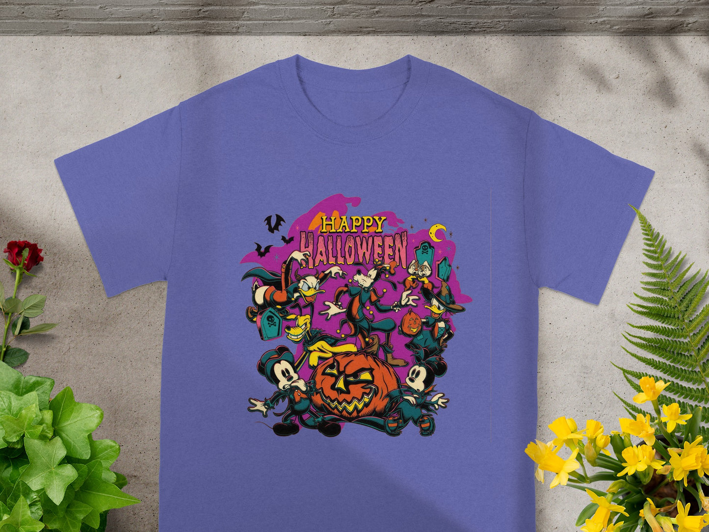 Purple t-shirt with a "Happy Halloween" graphic featuring Disney characters dancing around a jack-o'-lantern.