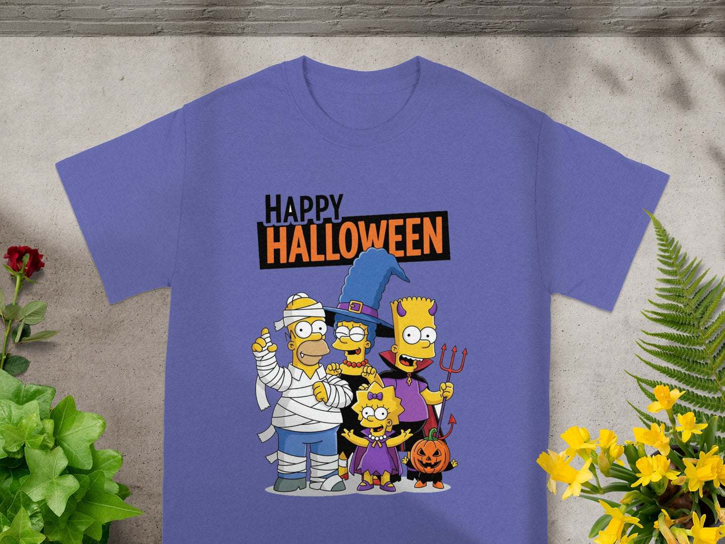 The Simpsons family in Halloween costumes with "Happy Halloween" text.