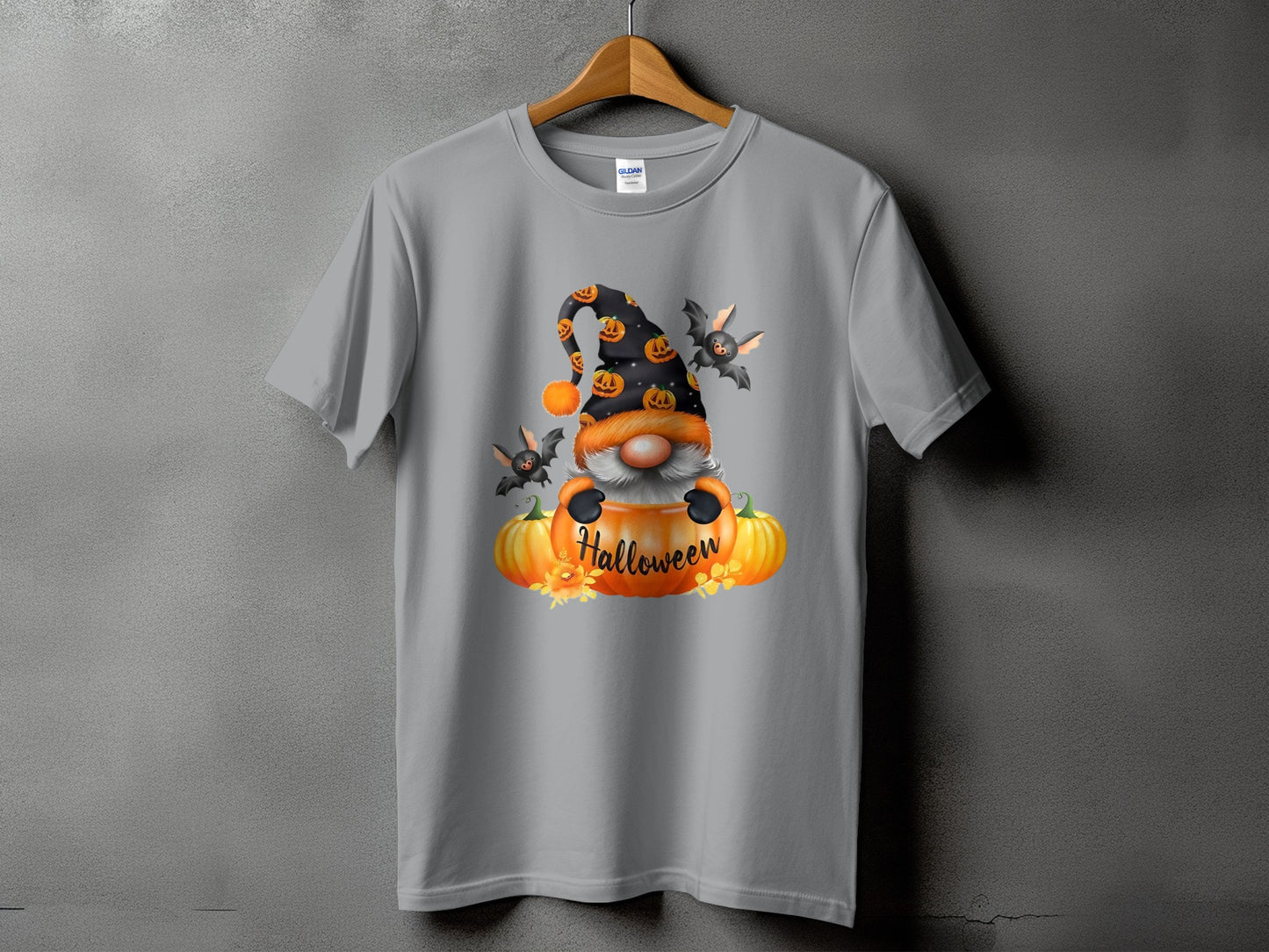 Gnome with pumpkins and bats graphic that reads "Halloween" on a gray t-shirt.