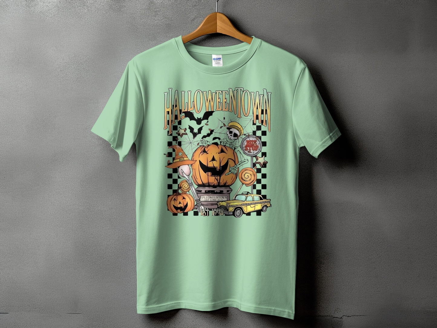 Halloweentown graphic t-shirt with pumpkins, skeleton, bats, and yellow taxi.