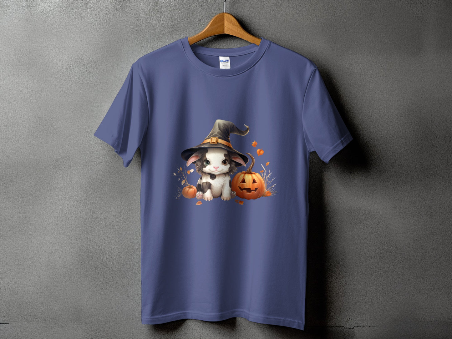 Cute bunny in witch hat with pumpkins and autumn leaves graphic on a purple t-shirt.