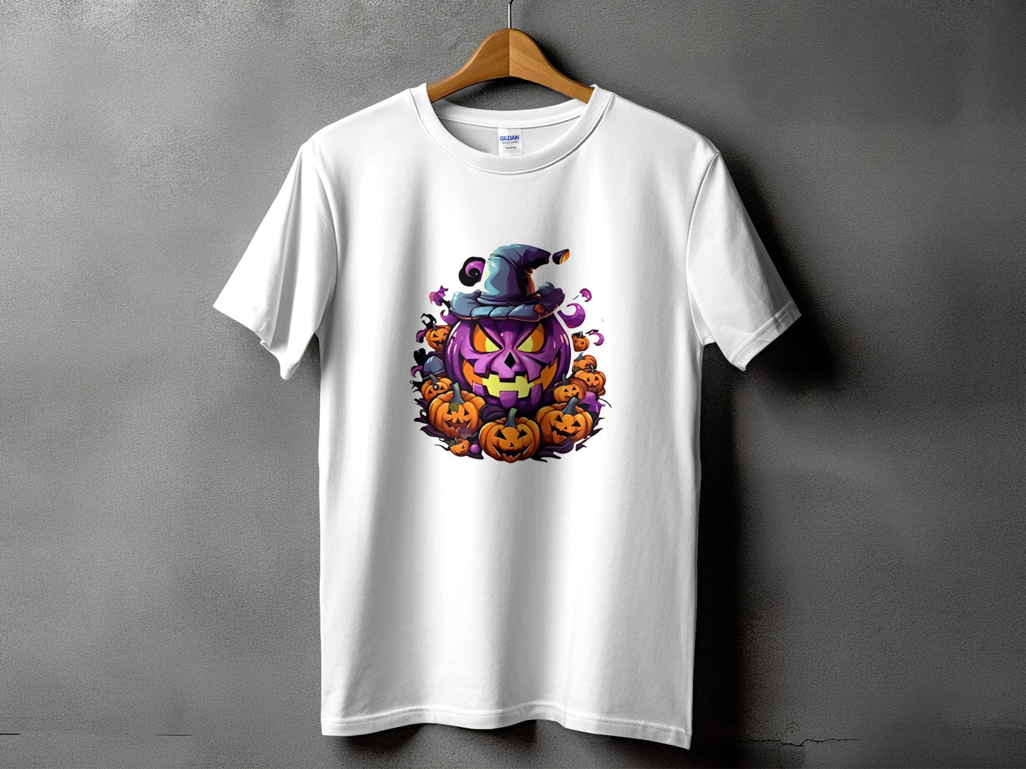 White t-shirt with a Halloween graphic of a large purple pumpkin wearing a hat surrounded by smaller pumpkins.