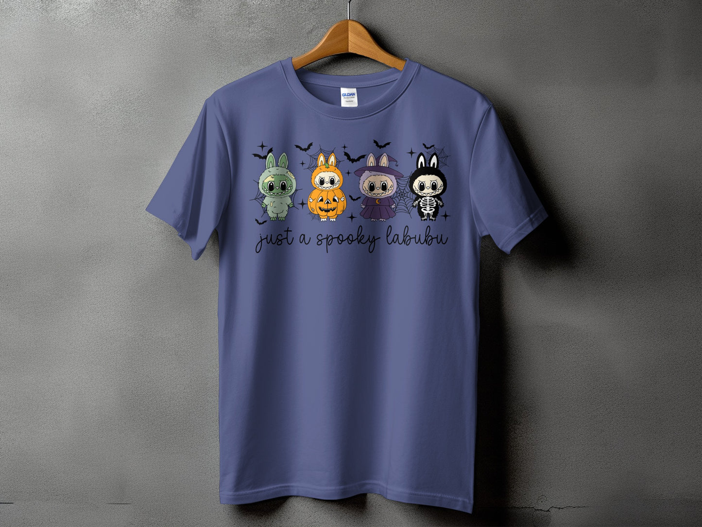 Purple t-shirt with four Halloween-themed cartoon characters and "just a spooky labubu" text.