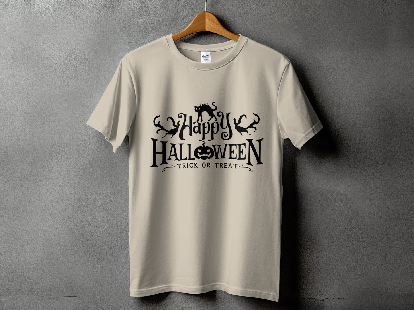Light tan t-shirt with black Halloween graphic of a cat and pumpkin.