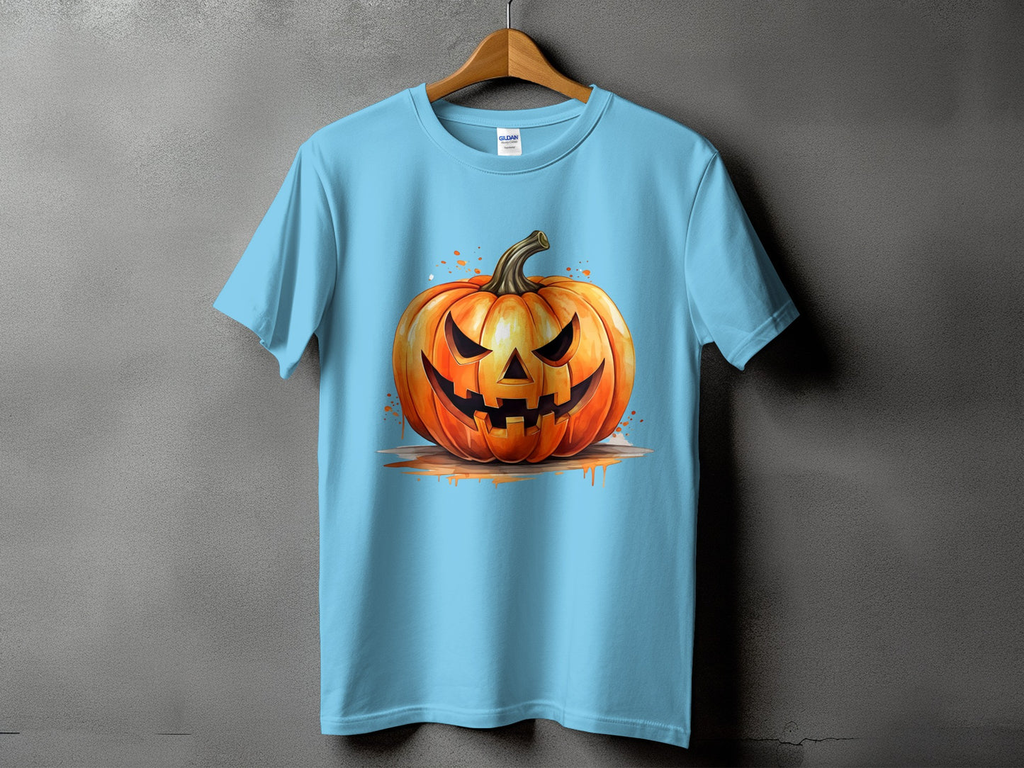 Light blue t-shirt with a watercolor style jack-o'-lantern graphic.