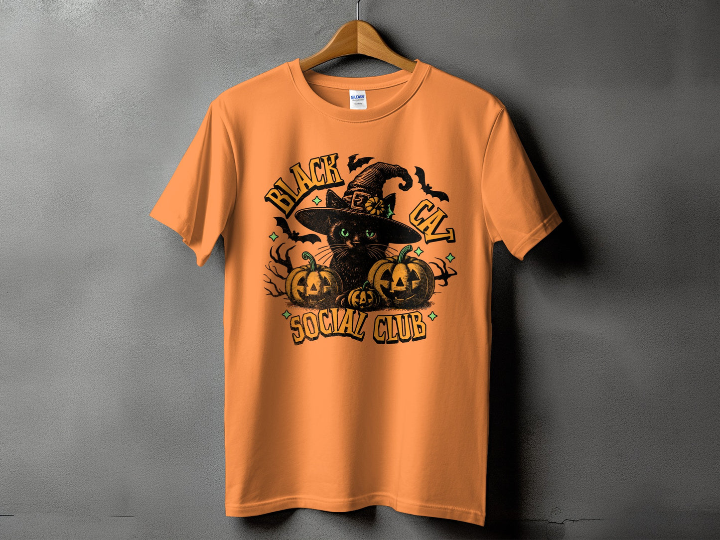 Orange t-shirt with black cat, pumpkins, bats, and "Black Cat Social Club" text.