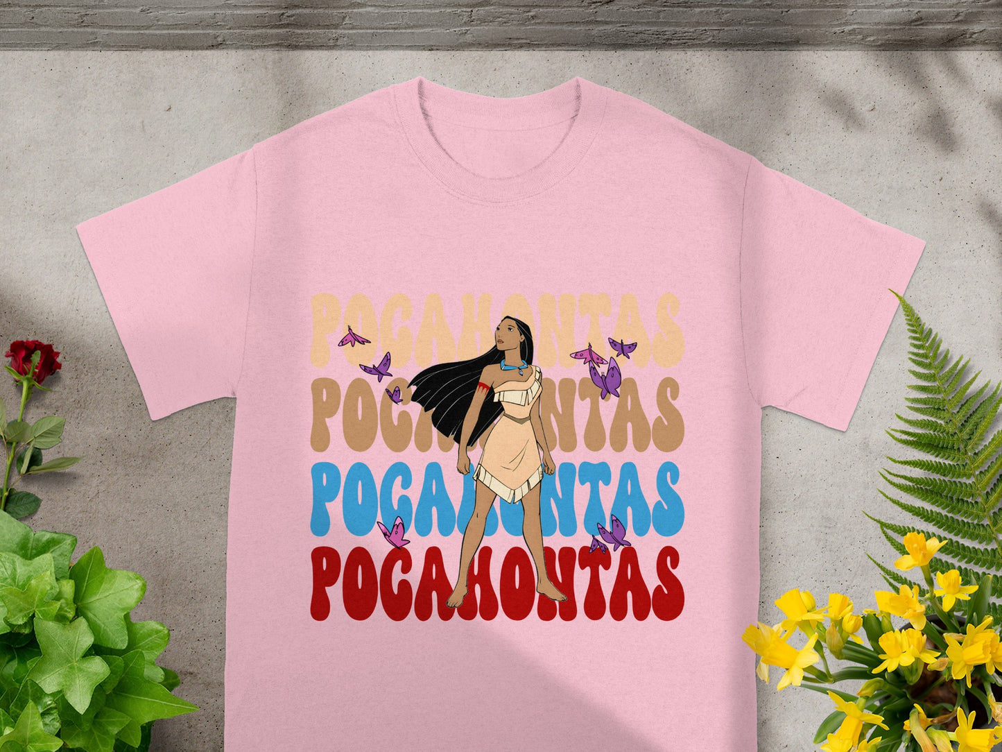Pink t-shirt with "Pocahontas" in colorful, retro lettering and butterflies.