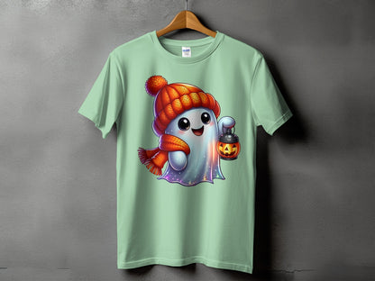 Mint green t-shirt with a cartoon ghost wearing a hat and scarf holding a jack-o-lantern.