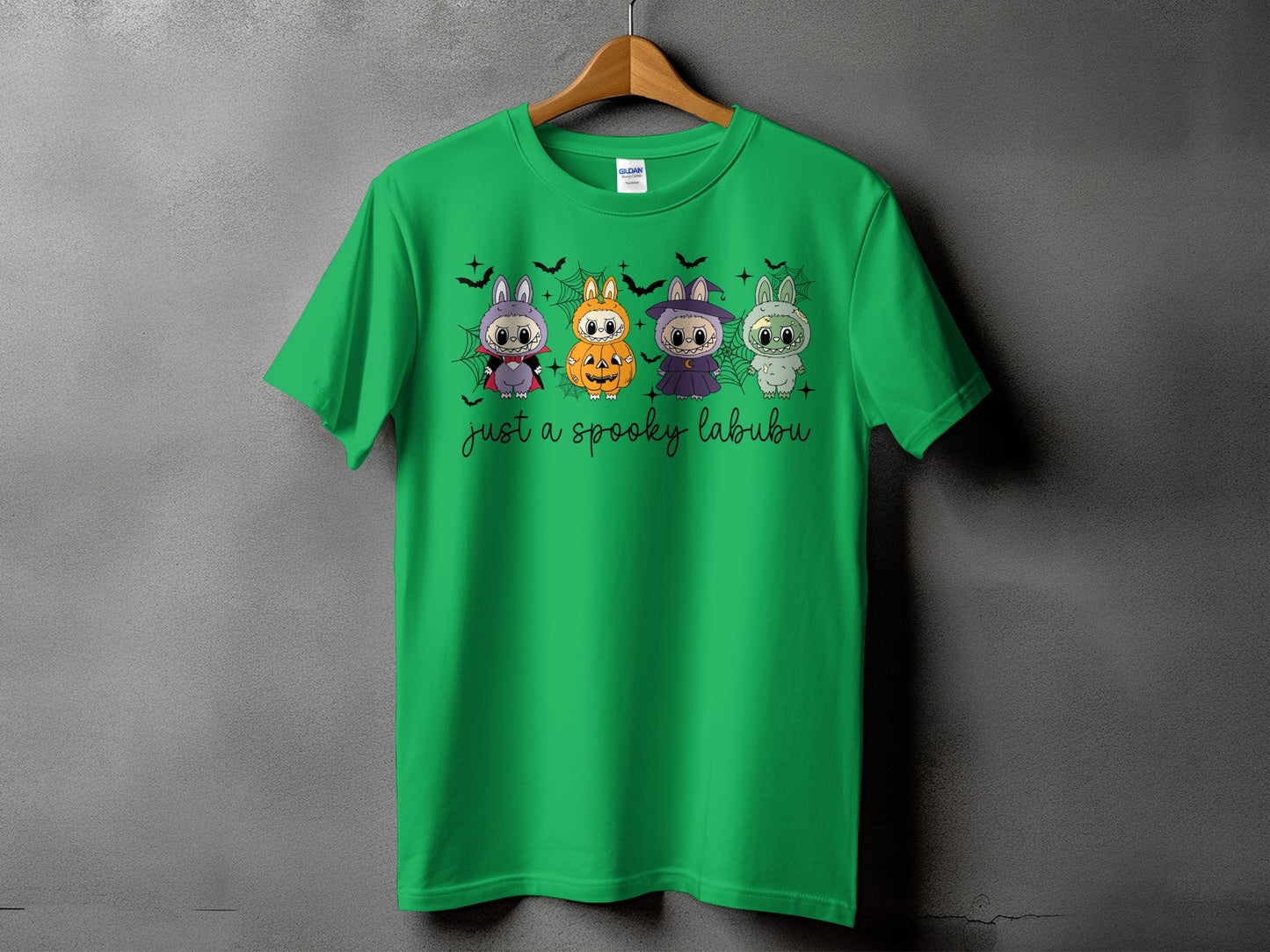 Green t-shirt with four Halloween-themed Labubu characters and text "just a spooky labubu".