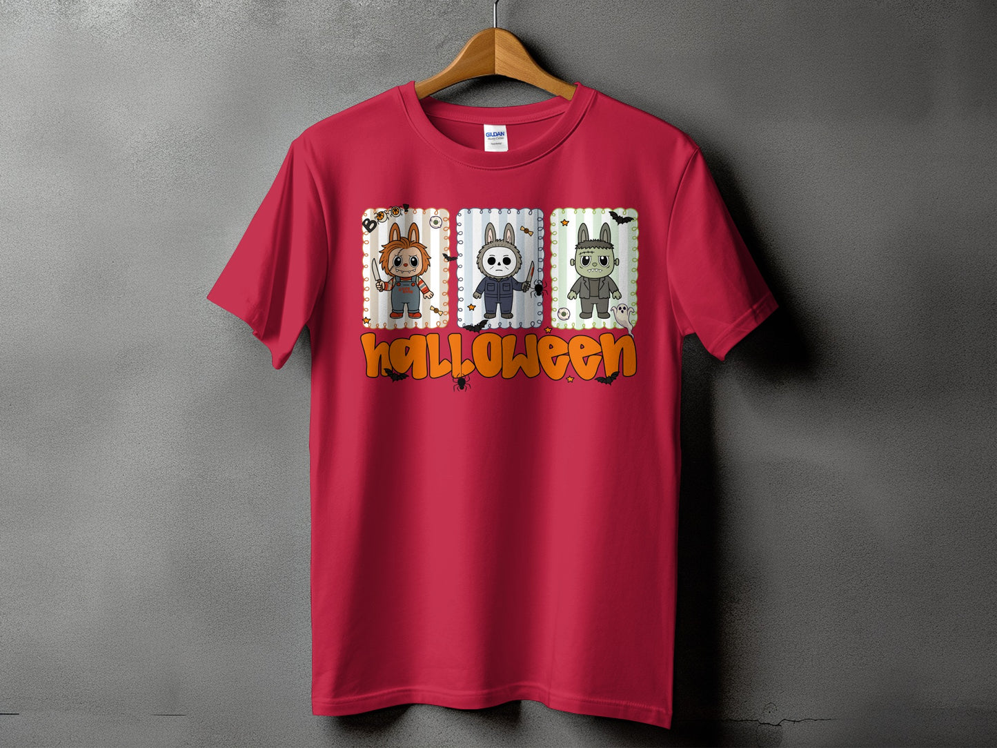 Red t-shirt with Halloween graphic of three cartoon characters and text.