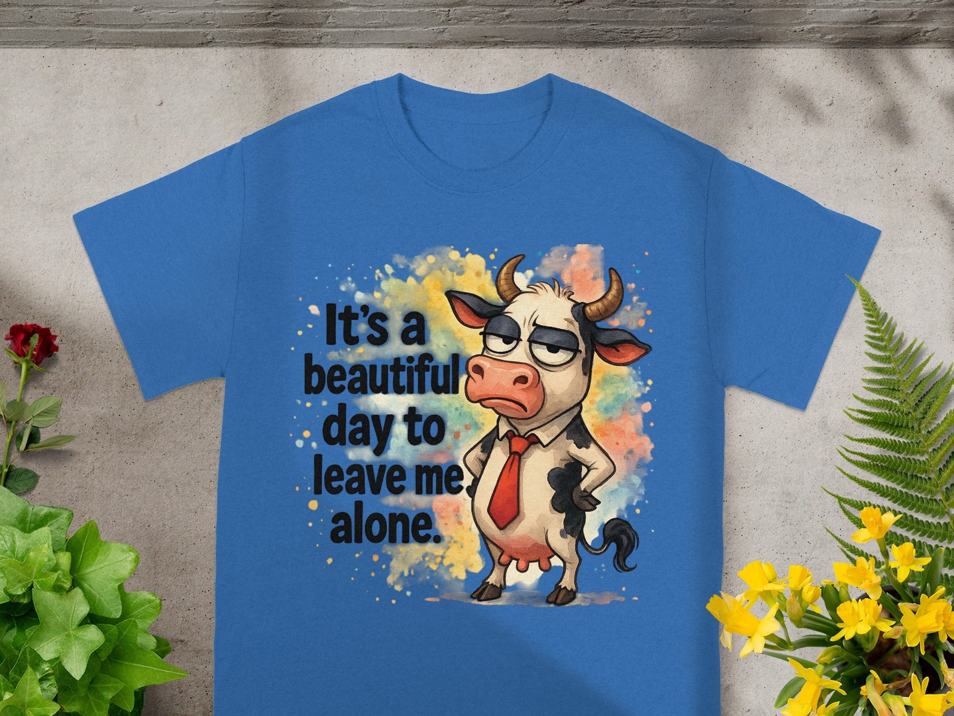 Blue t-shirt with a cartoon cow wearing a tie and the text "It's a beautiful day to leave me alone."
