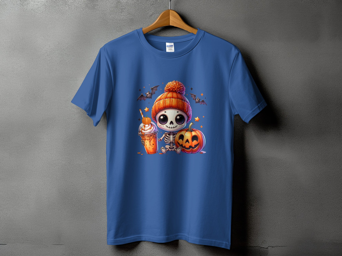 T-shirt with cute skeleton, pumpkin, and Halloween drink graphic.
