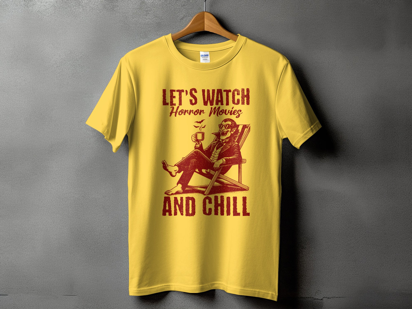 Yellow t-shirt with "Let's Watch Horror Movies And Chill" text and vampire graphic.