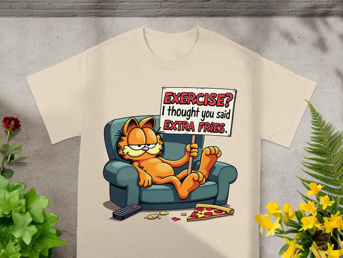 Garfield on couch holding sign "Exercise? I thought you said extra fries."